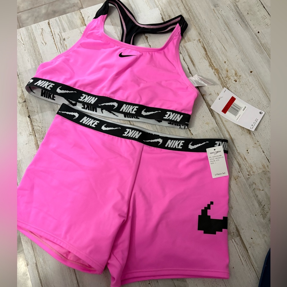 Pink Nike two piece swimsuit with swim shorts. NWT size Large.